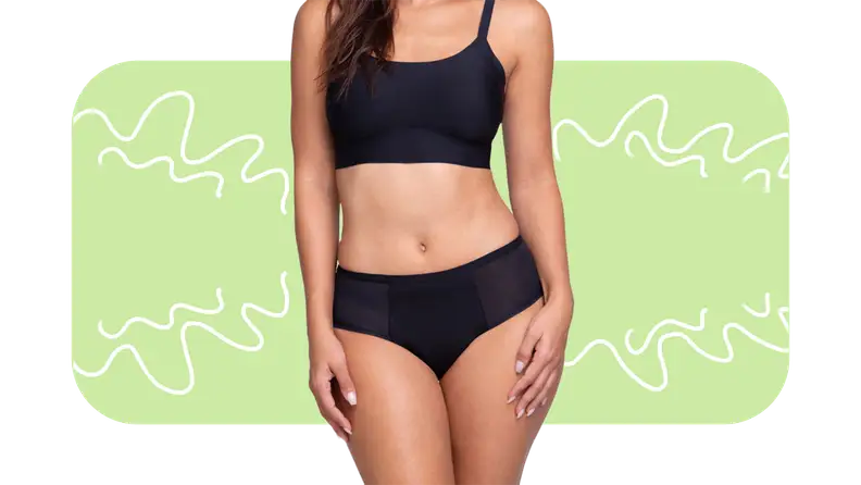 Model wearing solid black sports bra and hipster underwear set.