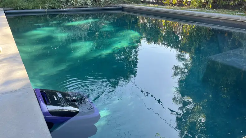 Beatbot Sora 70 pool cleaner seen under the surface of the pool.