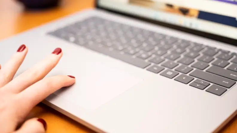 person uses trackpad