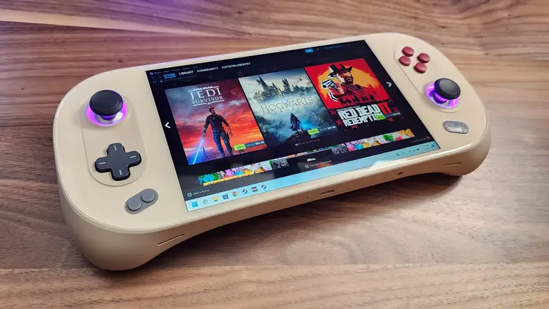 Ayaneo 2S Handheld Gaming PC with screen displaying movie streaming options on top of hardwood surface.