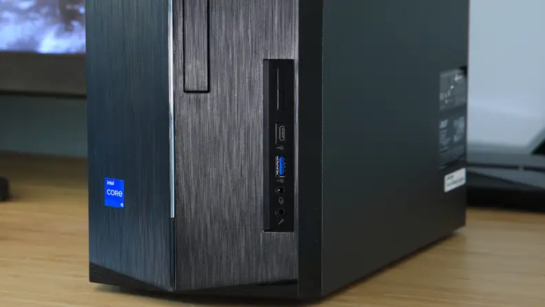 A black Acer desktop computer tower sits on a desk.