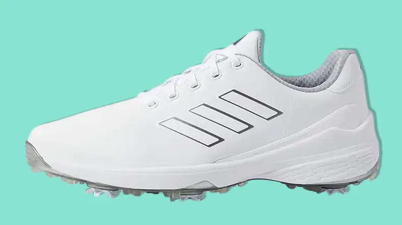 Adidas Men's ZG23 Golf Shoe on a teal background.