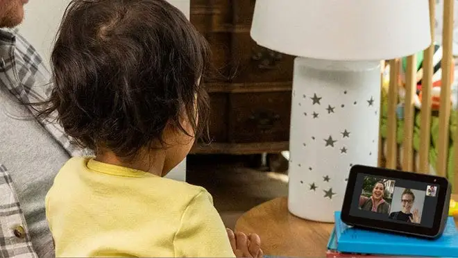 A child looking at the Amazon Echo Show 5 display.