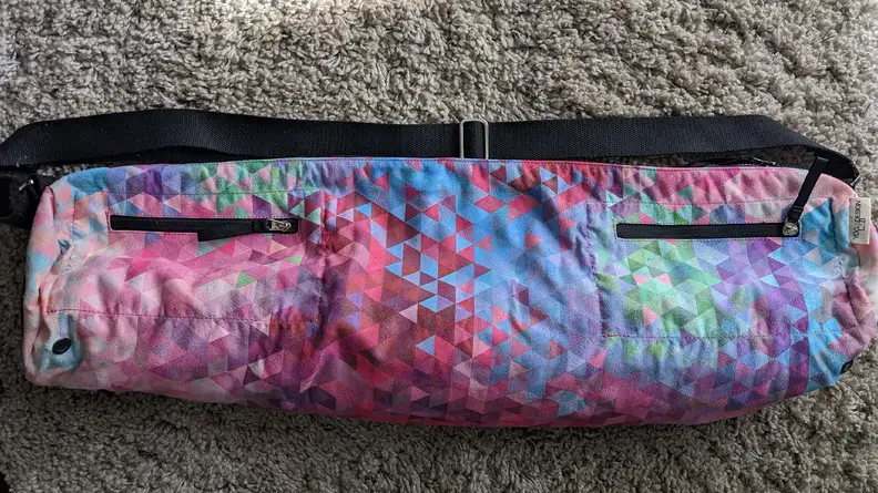 Yoga Design Lab Yoga Bag resting on a carpeted floor