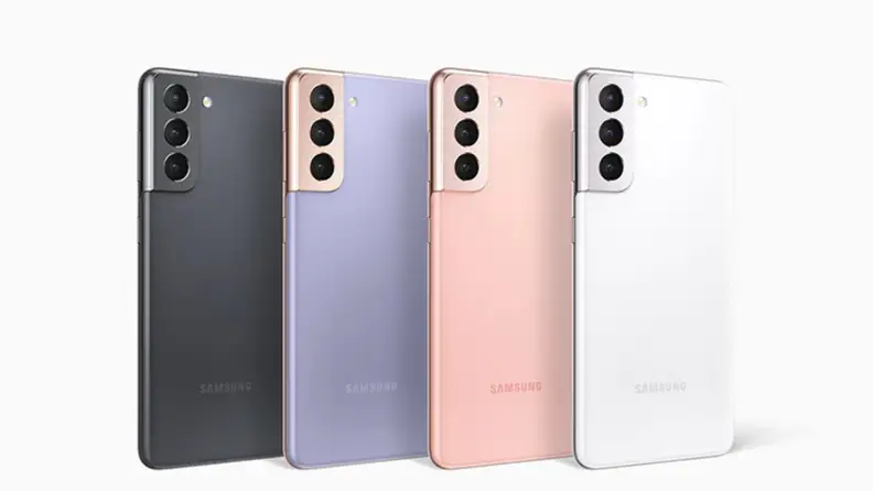 Four multi-colored smartphones lined up together in front of white background.