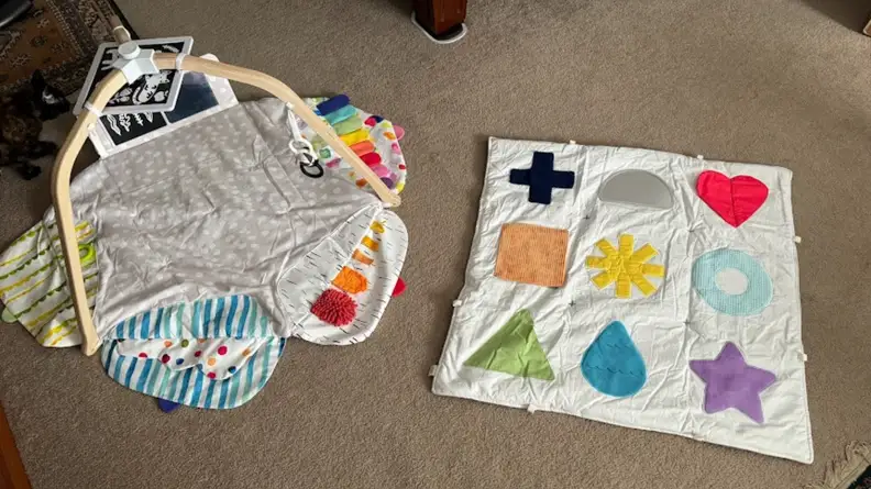 Lovevery play mat next to the KiwiCo play mat