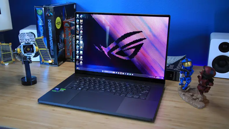 The Asus ROG Zephyrus G16 latop sitting a desktop.
