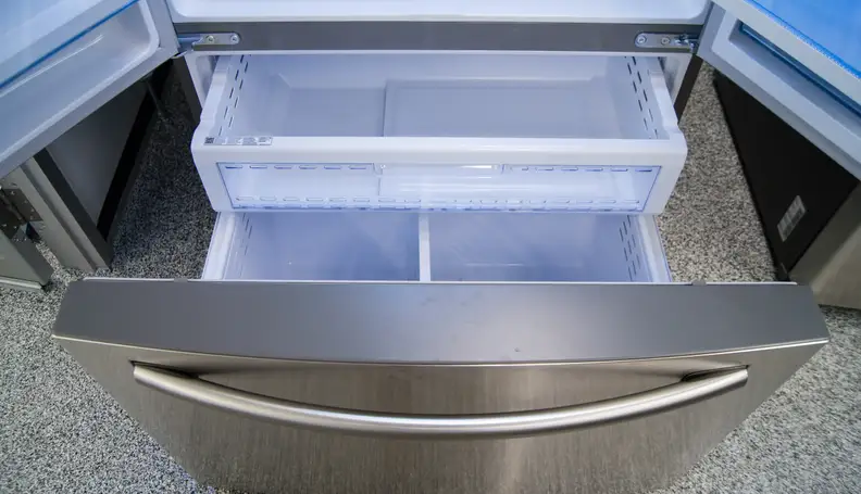 A basic pull-out freezer with two levels of storage. There's a shallow shelf hidden just inside the door of the Samsung RF28HDEDBSR.