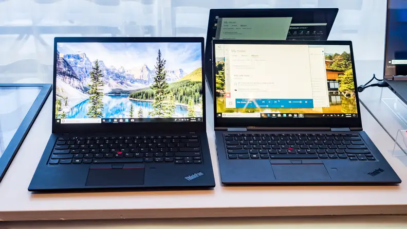 The Lenovo X1 Carbon (left) and X1 Yoga