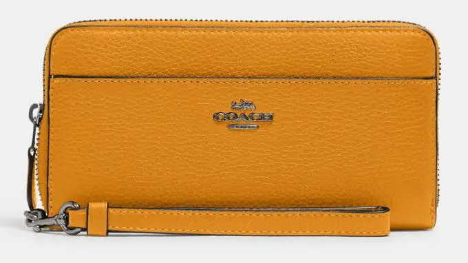 A bright yellow coach wallet