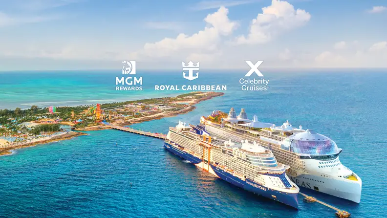 MGM Rewards partnership image showing Royal Caribbean and Celebrity Cruises ships docked at a tropical island destination surrounded by turquoise waters.
