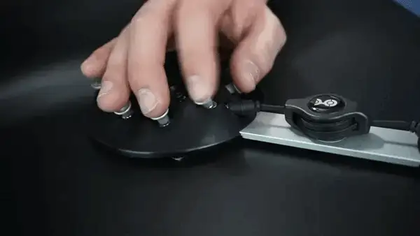 Person using single hand to operate the keys on the black Charachorder keyboard.