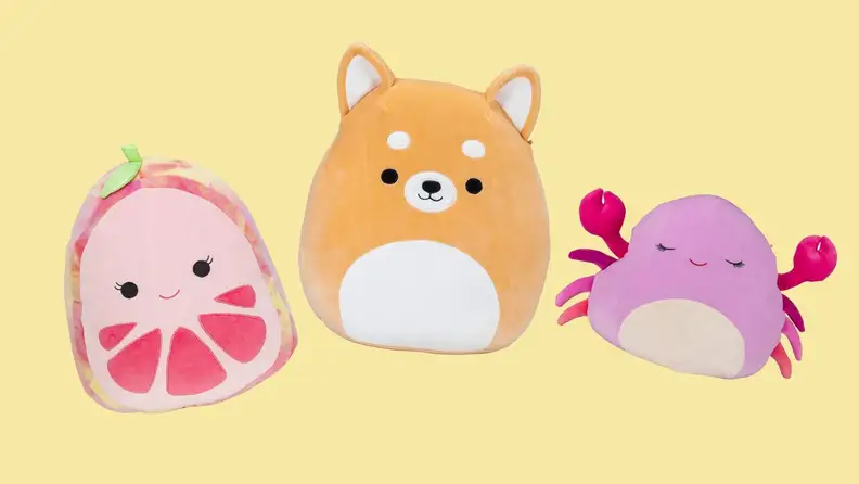 Grapefruit, dog, and crab Squishmallow plush stuffed toys on yellow background