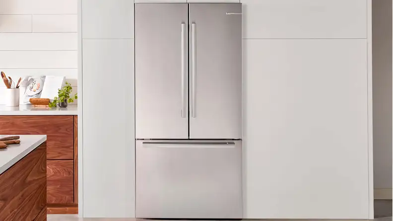 The Bosch B36CT80SNS fridge in a white kitchen.