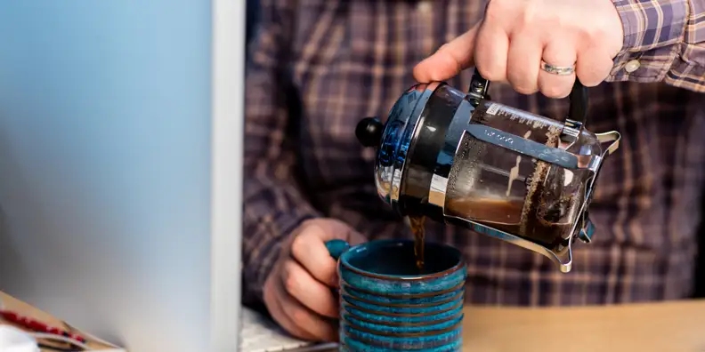 A desk-sized french press coffee maker