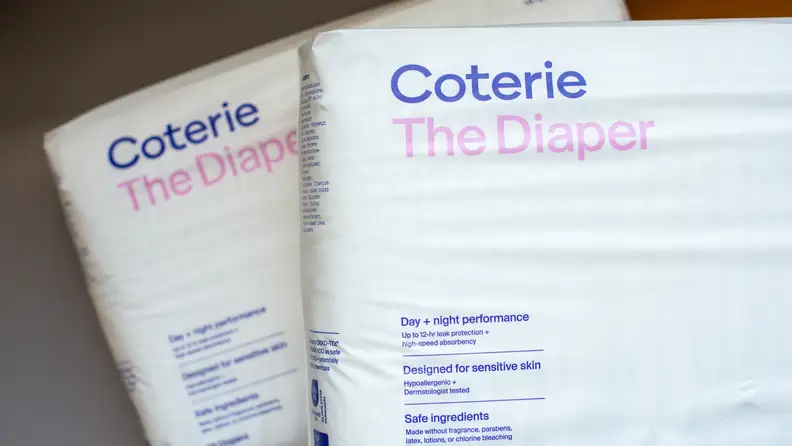 Two packages of Coterie's The Diaper on top of each other.