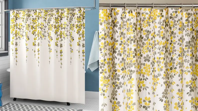 A shower curtain with yellow flowers.