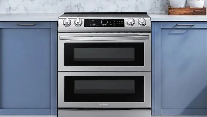 Silver stovetop/oven in neutral kitchen