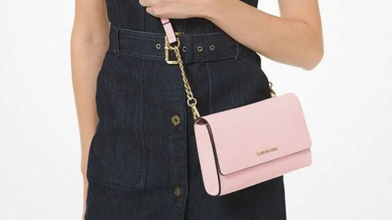 woman wearing pink Michael Kors crossbody