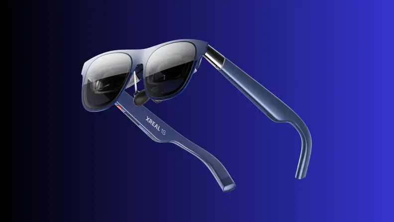 A pair of XREAL smart glasses is shown against a blue gradient background, highlighting the sleek frame and built-in display technology unveiled at CES 2026.