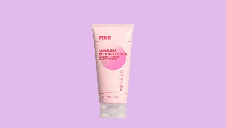 A bottle of lotion against a hot pink background.