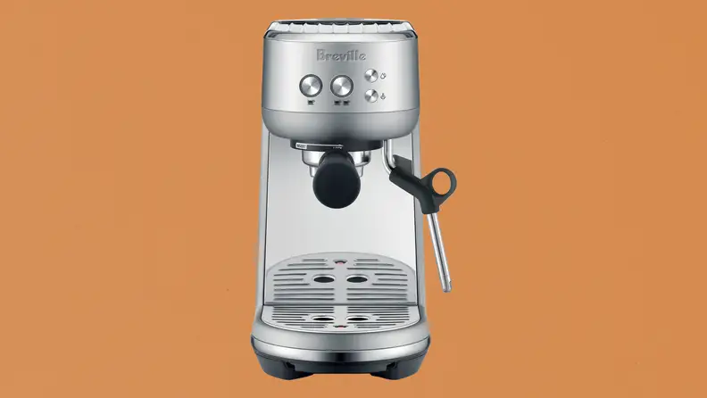 Breville Bambino  espresso maker on brown paper-like background