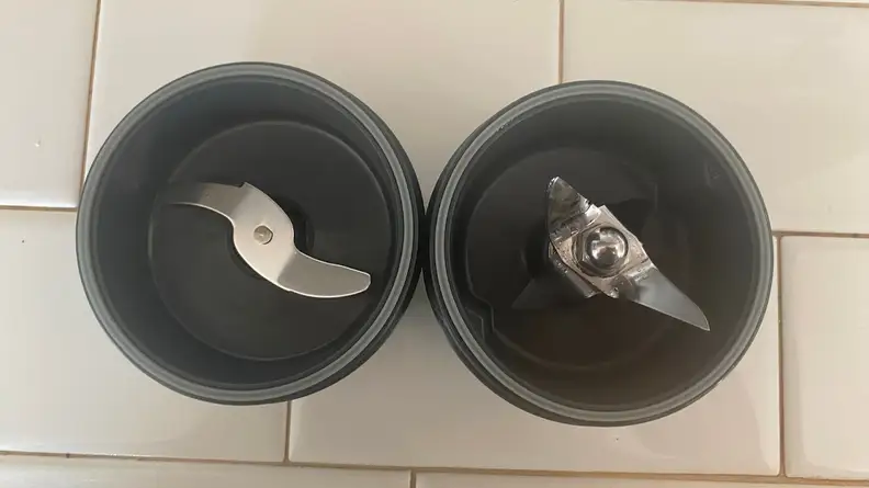 Two interchangeable blades for the Cuisinart Hurricane blender.