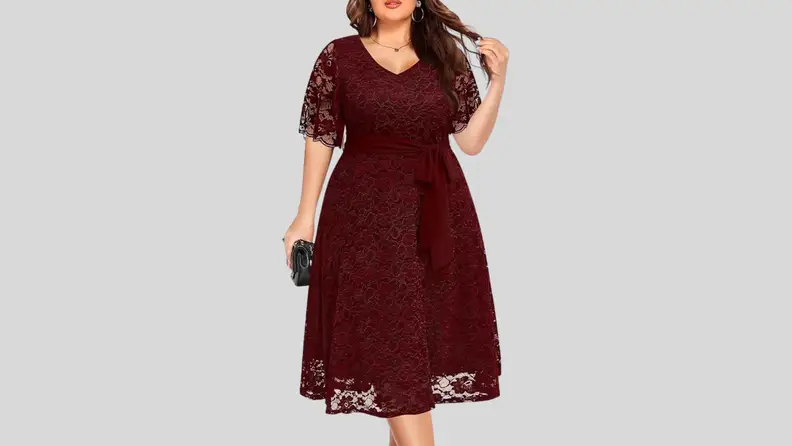 Woman in burgundy lace party dress