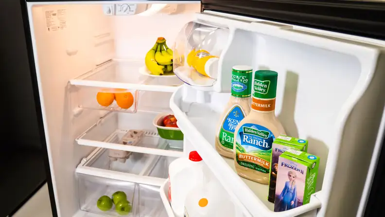 A shot of the interior of the Frigidaire FFTR2021TS top-freezer refrigerator's main compartment, filled with groceries for scale.