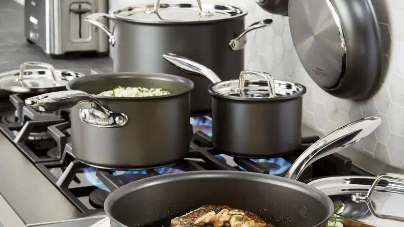 Pots and pans cooking on a stove