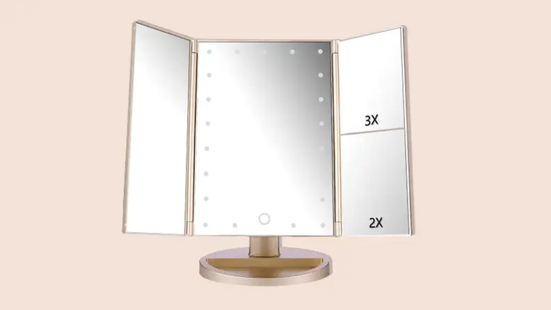 A gold DeWeisn Tri-Fold Lighted Mirror opened fully on a tan background.