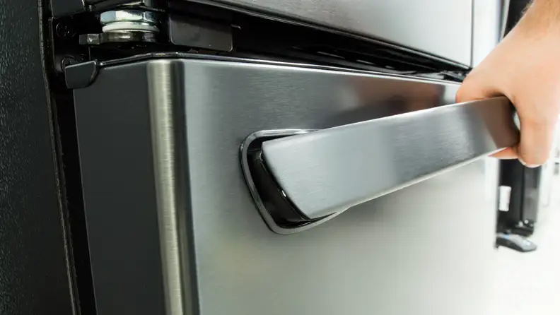Pull up on the freezer handle to open