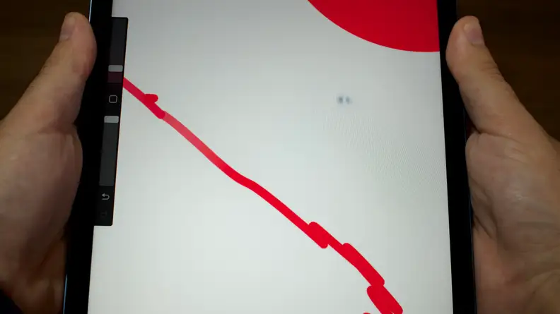 A close-up of the M1 iPad Air's screen being distorted when pressure is applied to the back.