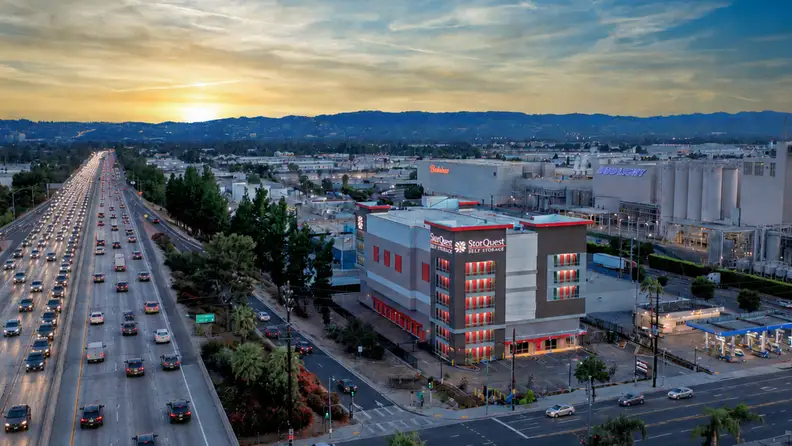 A storage building in the heart of a city at sunset
