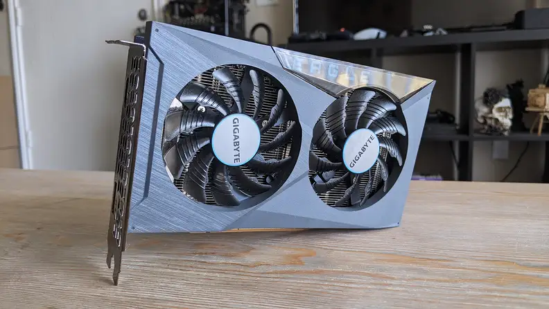 A desktop graphics card standing up on a coffee table