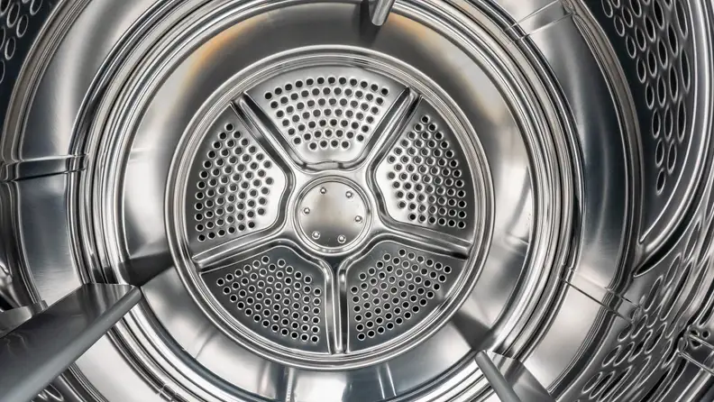 A close-up of the Frigidaire FFRE4120SW dryer's stainless steel drum.