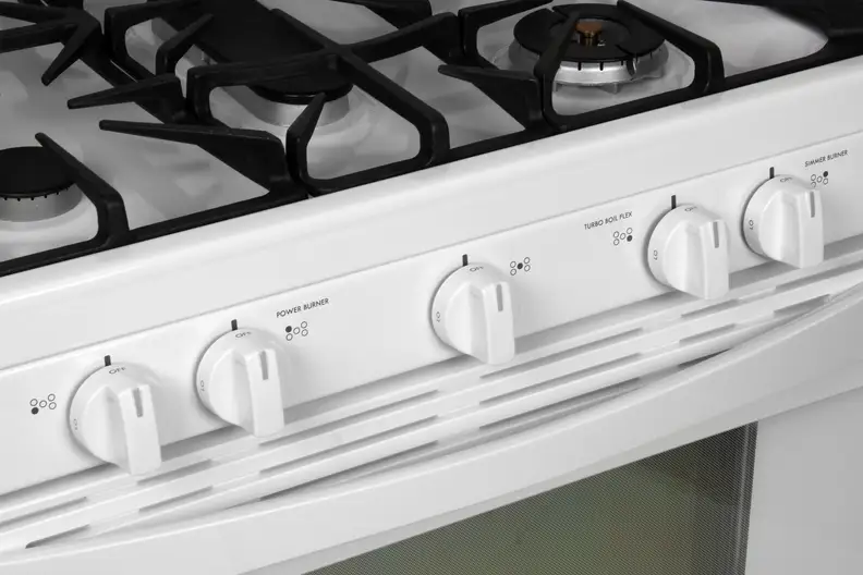Oven knobs and dials.