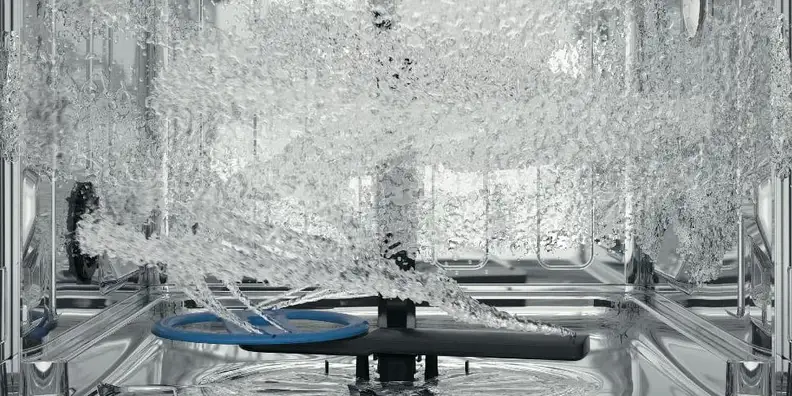 Water spinning around inside of a dishwasher.