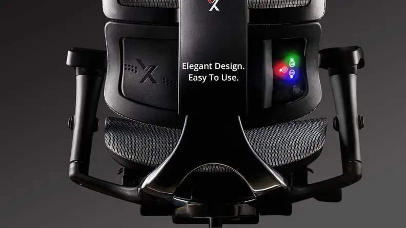 Close-up of the X-HMT Office Chair, which features glowing colored lights for built-in heat and massage controls. The tagline reads, "Elegant design. Easy to use."
