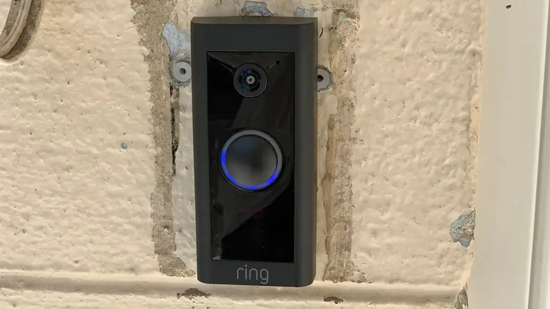 The Ring Video Doorbell Wired is installed on the front of a home.
