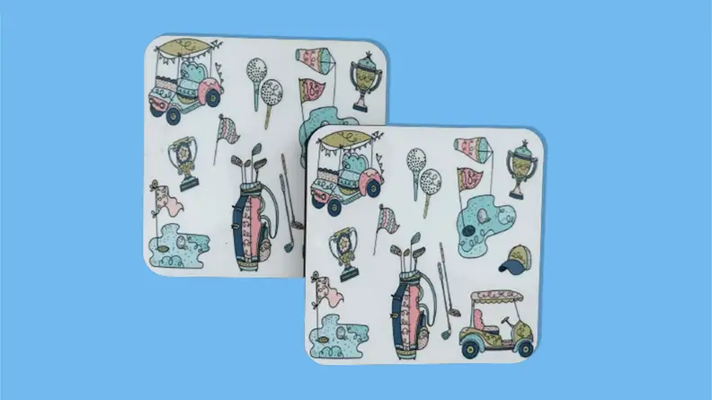 Kitschy golf coasters on a blue background.