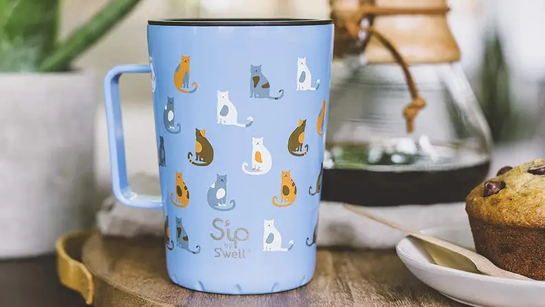 The double-walled mug can keep drinks hot or cold.