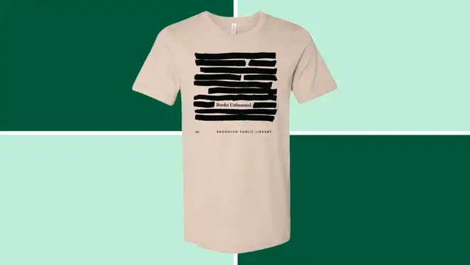 A Brooklyn Public Library Books Unbanned T-Shirt on dark and light green background.