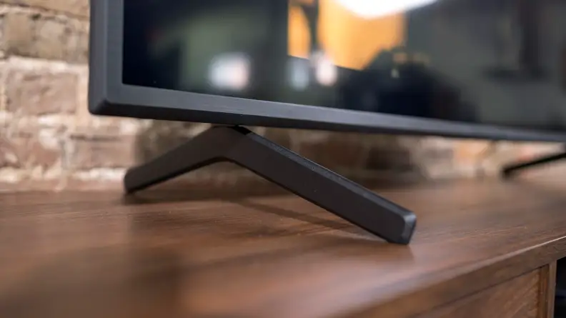 A close-up of the Sony X80J's wide-set, angular feet