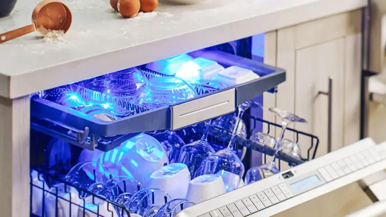A glowing light scheme illuminates the interior of this Thermador dishwasher