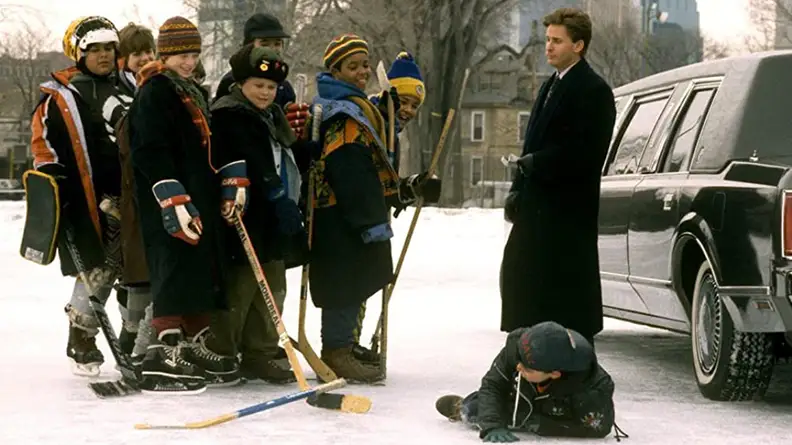 The Mighty Ducks laughing at a team mate who has slipped on the ice while Emilio Esteves watches stone-faced.