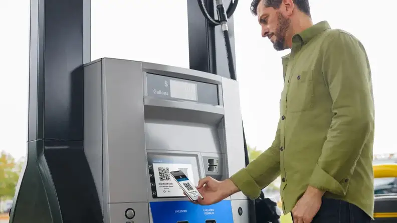 Customer using Sam's Club app to pay for gas at the pump