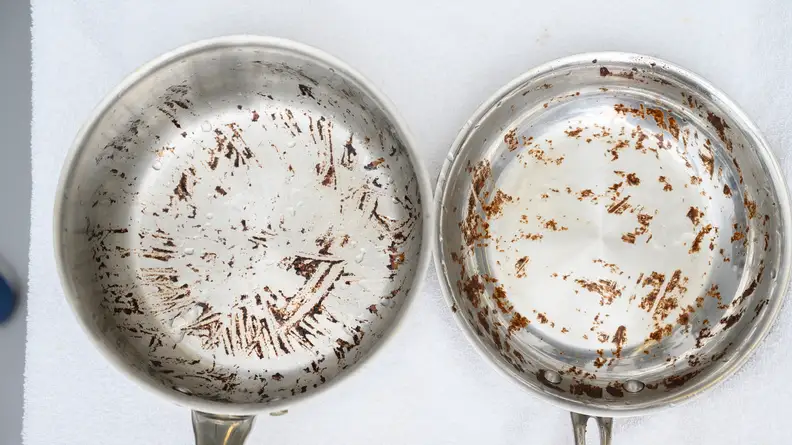 The pot with the tomato sauce stain (left) and the skillet with the brownie stain (right) soaked for 2 hours, and were then lightly hand-scrubbed.