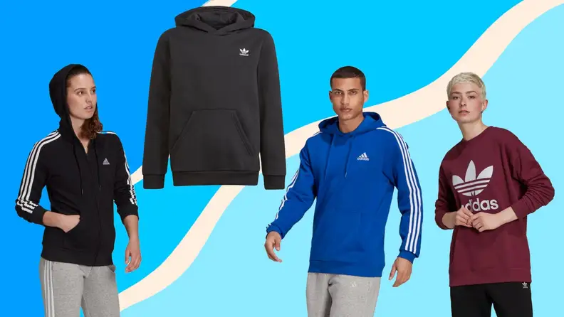 Three people wear colorful Adidas sweaters.
