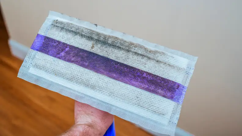 A dirty flat mop head.